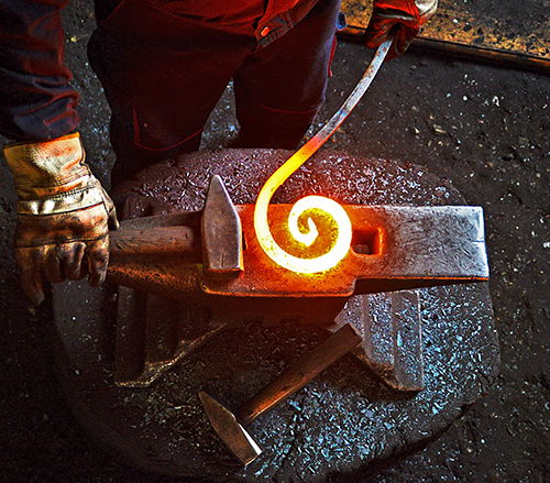 blacksmith forging a spiral